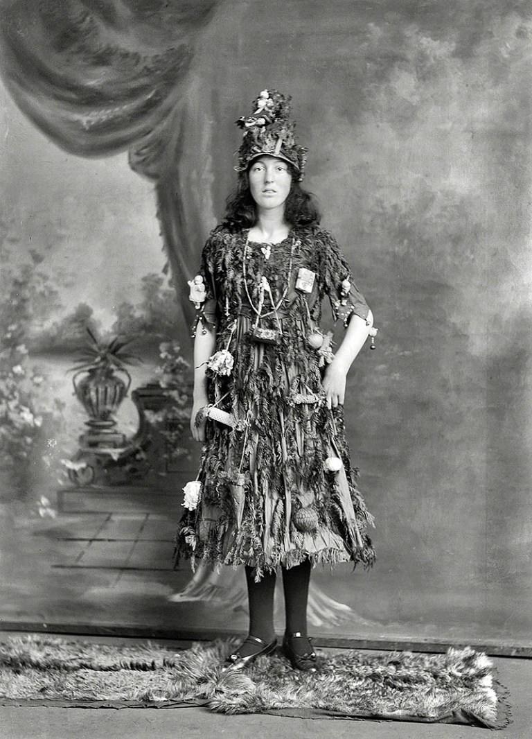 A young lady dresses as a Christmas Tree in Christchurch, New Zealand in 1910.