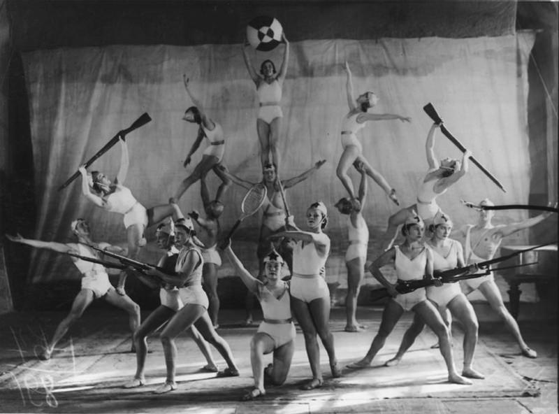 Acrobats pose for a picture showing perhaps the countries strengths somewhere in the USSR, 1934.