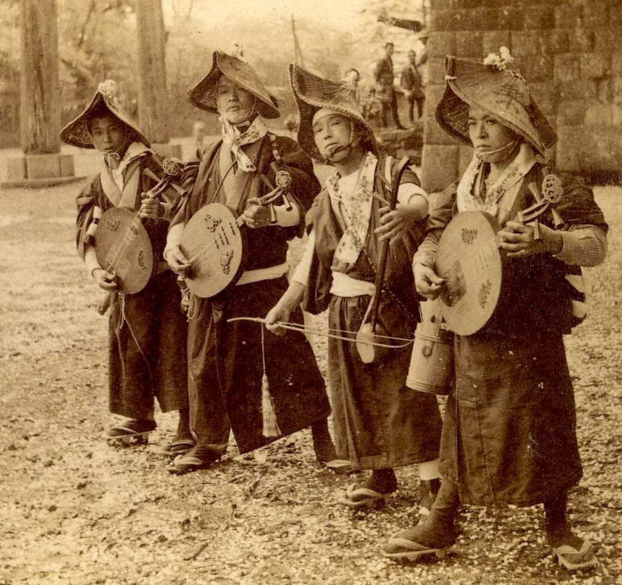 A group of traveling musicians in Japan, 1900.