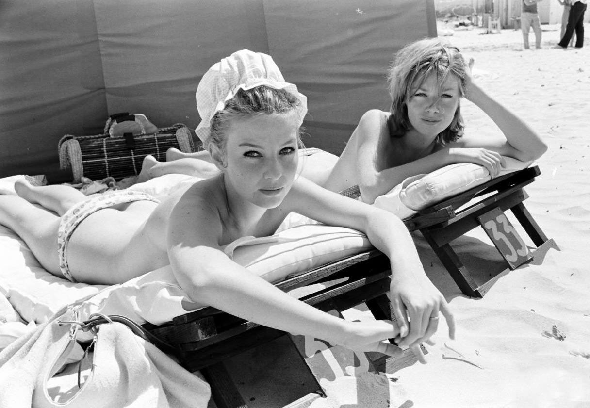Danish actress Annette Stroyberg sunbathing with a friend, 1956