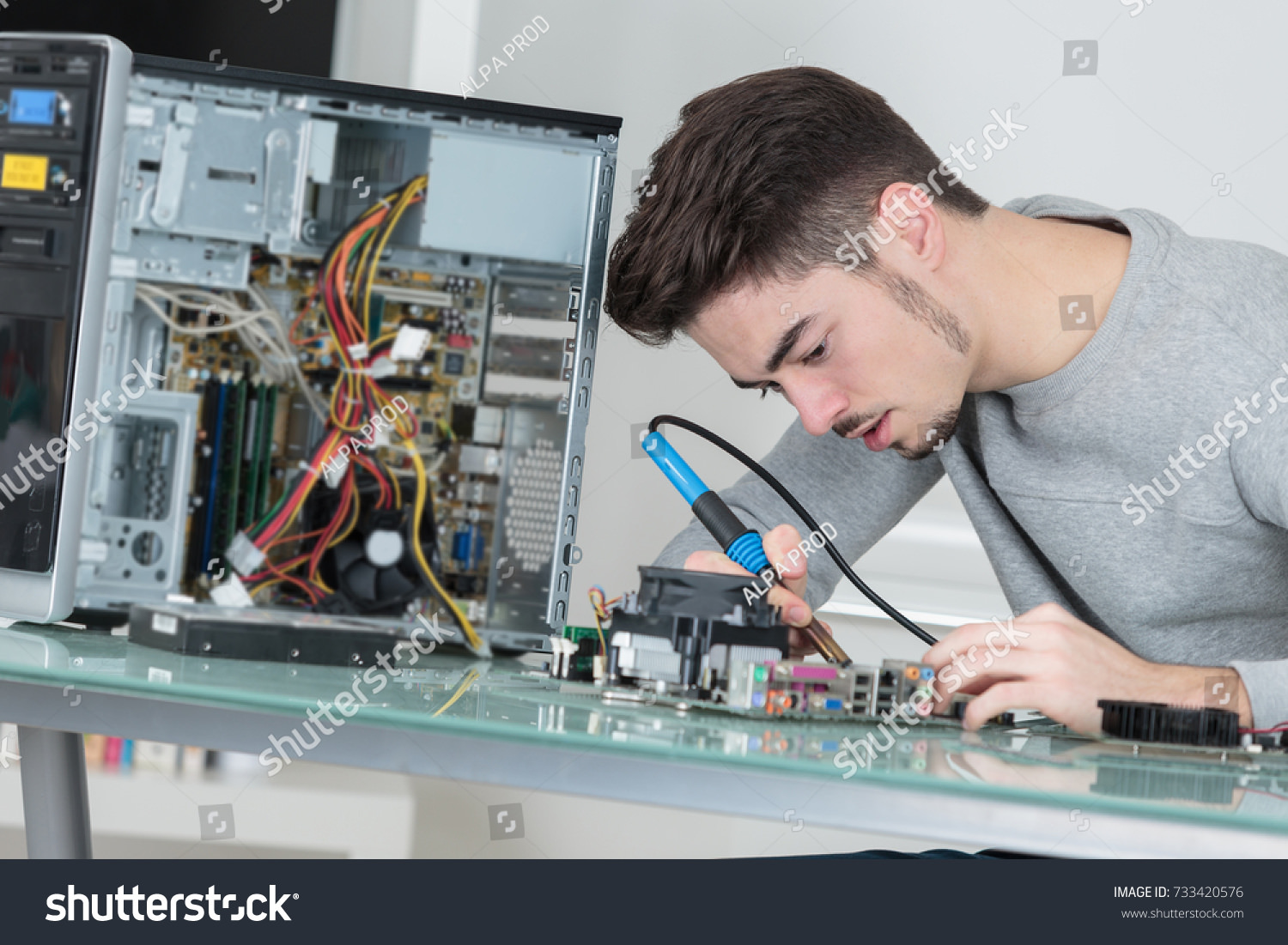 Stock Photos of People Repairing Electronics That You Better NOT Follow