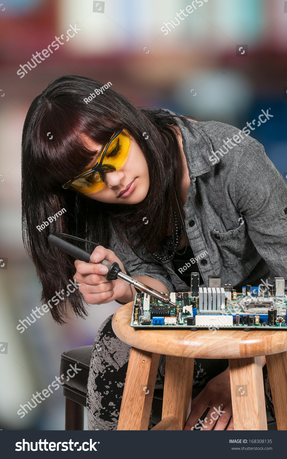 Stock Photos of People Repairing Electronics That You Better NOT Follow