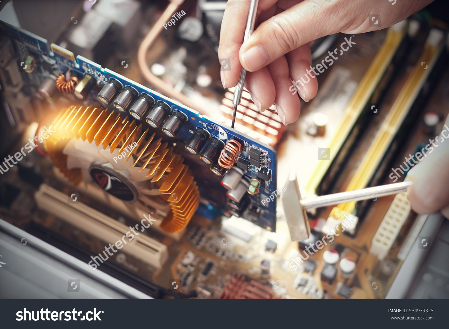 Stock Photos of People Repairing Electronics That You Better NOT Follow