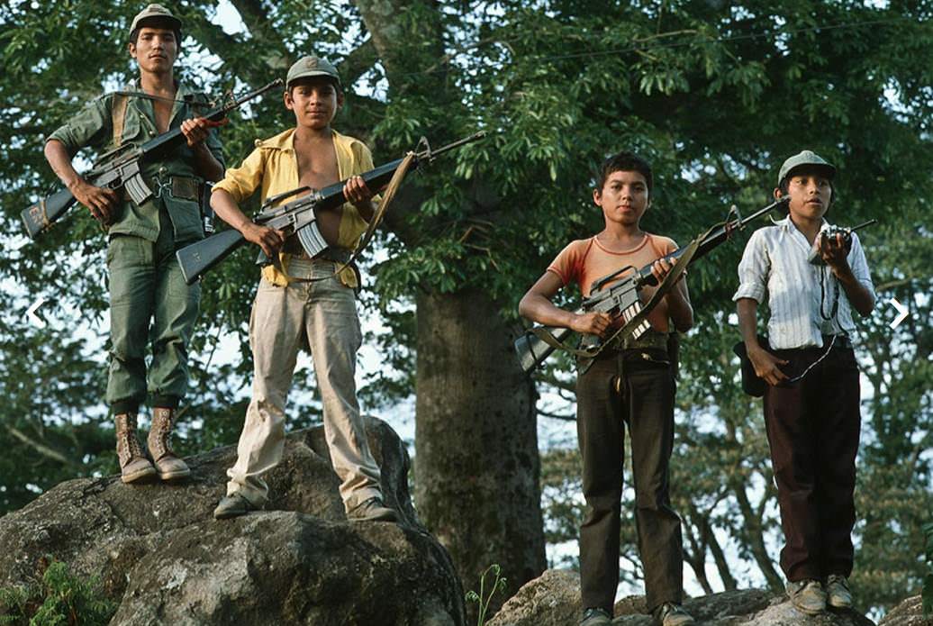3 FMLN Child soldiers with their commander pose for a picture in El Salvador in 1983. The FMLN guerillas forced children into their ranks, and rarely did anyone have a choice. This all occured during the El Salvadorian Civil War, with lasted from 1979 all the way until 1992. Eventually the FMLN and their supporters lost and were disbanded. Both sides committed crimes against civilians, but the FMLN and other rogue factions had death squads that were brutal. Their activities along with forced conscription caused 1/5 of the entire countries population to be displaced, with many fleeing to the US. Less than 30,000 people died in actual fighting during the 13 year war, but up to 100,000 civilians were killed, many by those said death squads.