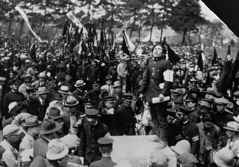 Working class men organize a protest against labor issues in Japan in 1925. Imperial Japanese rule had labor issues throughout the 1920s, and it caused unrest at home. Most of the demonstrations were from the work force, eager for better government programs and solutions to the labor issues. When Japan prepared to be more aggressive against other nations, it also increased their industrial areas, giving such people as these the jobs they desired. Germany, France, England, Japan, and the US, among other countries, all had labor issues around the 1920s and 30s solved mainly by industrialization of the country in preparation for war. In this protest, no one would be killed, but some did clash with police and some violence took place. Also, about 150 were arrested.