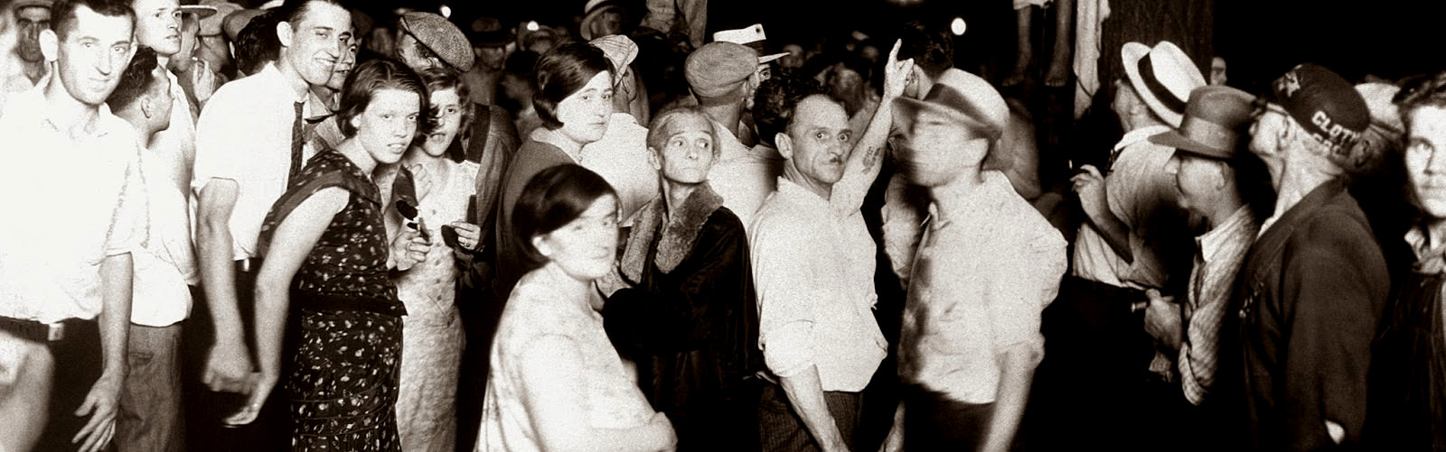 The many faces of the people who watched the lynching of Abram Smith and Thomas Shipp in Indiana, US, in 1930. You can see the lynched men's feet hanging. You can also see the unedited picture with a simple search.