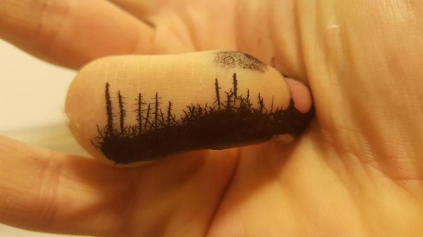 Ink on a finger.