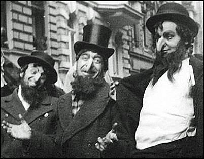 Men dress up to make fun of Jews in Berlin, Germany in 1933.