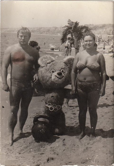 A child or little person dresses as the Soviet Olympic mascot called Misha at a beach in Russia in 1980.