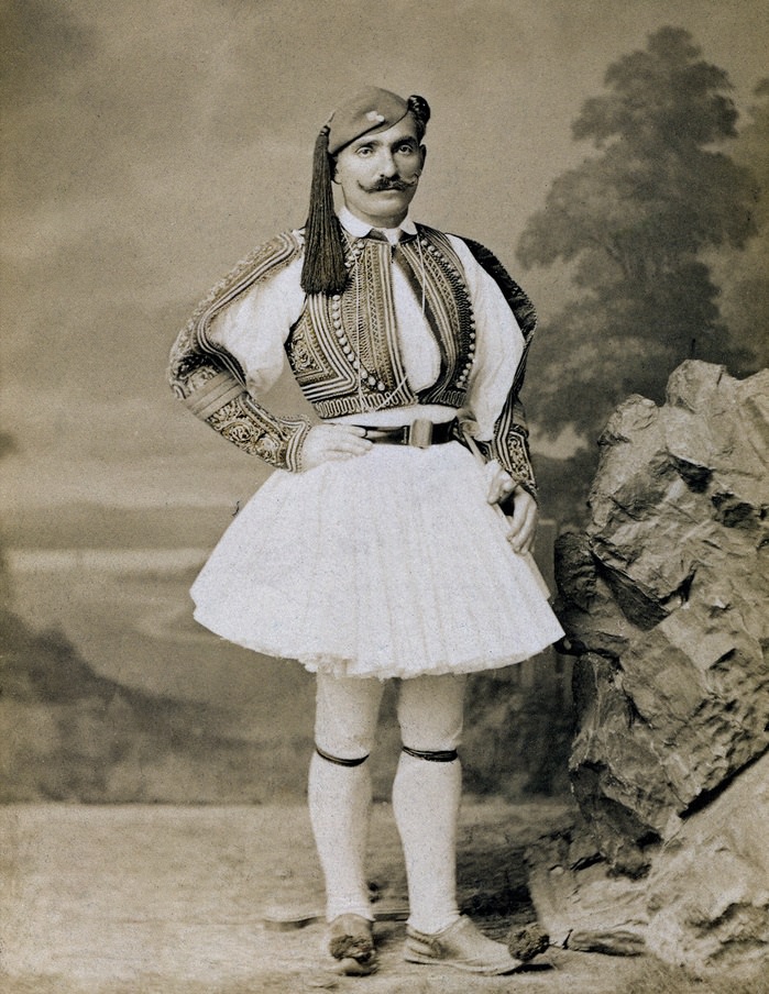 An Albanian man wearing a traditional dress like outfit called a fustanella in 1904.