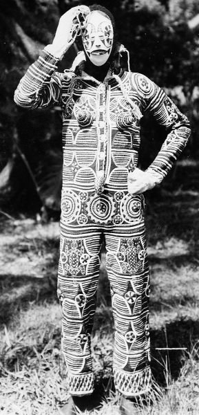 A man from Igboland in Nigeria wears a costume in preparation for a traditional masquerade dance.