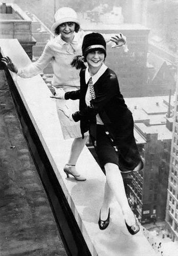 Flapper girls, possibly inebriated, dance "The Charleston" on top of the Sherman Hotel in Chicago, US in 1926.