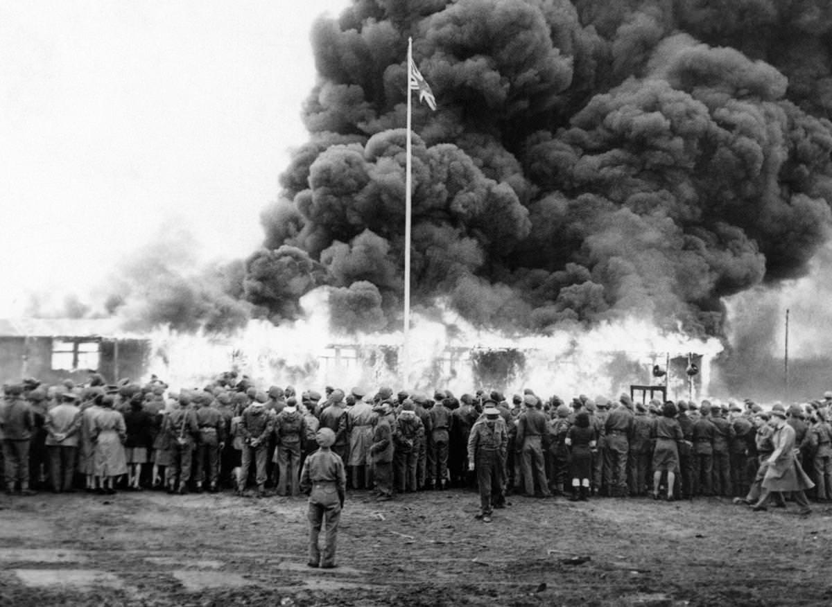 British personnel burn down the last building of Bergen-Belsen concentration camp in Germany, 1945.