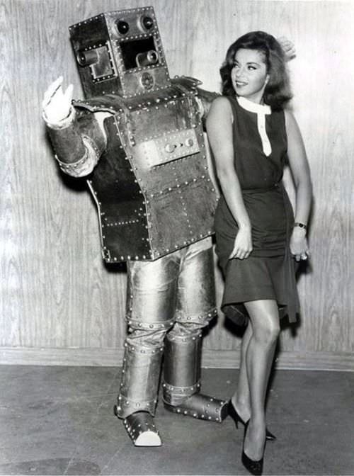 A woman dancing with a robot in the US, 1950.