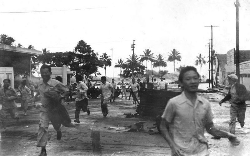 People running away from a tsunami hitting the coast in Japan in 1946. Over 2,000 would die with half a million becoming homeless.