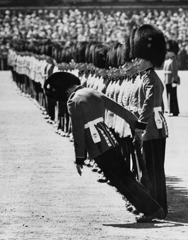 A guardsman begins to faint during the Trooping the Colour ceremony on Horse Guards Parade in England, 1957.