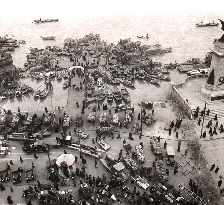 A busy area by the waterfront in Shanghai, China in 1927.