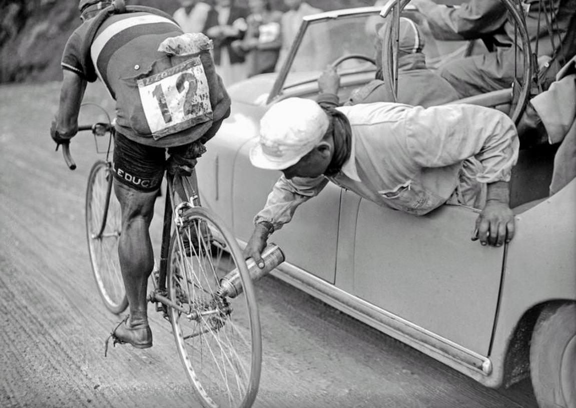 Cleaning the gears of a rider during the Tour de France in 1950.