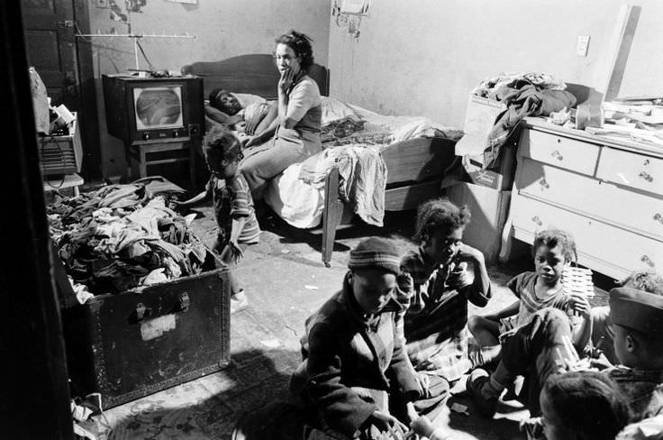A large family living in the slums of Chicago, US in 1954.