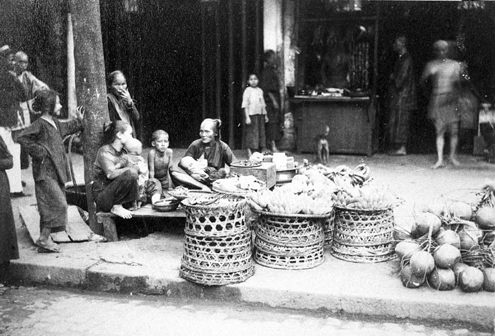 Vendors selling goods on the streets of Saigon, Vietnam in 1890.