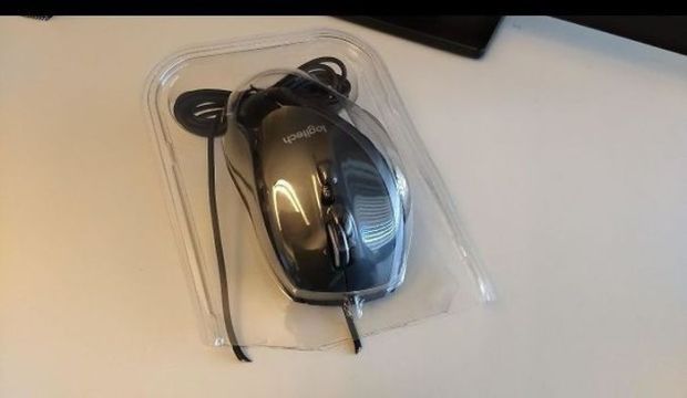 one of my coworkers was eager to unpack her new mouse - logitech