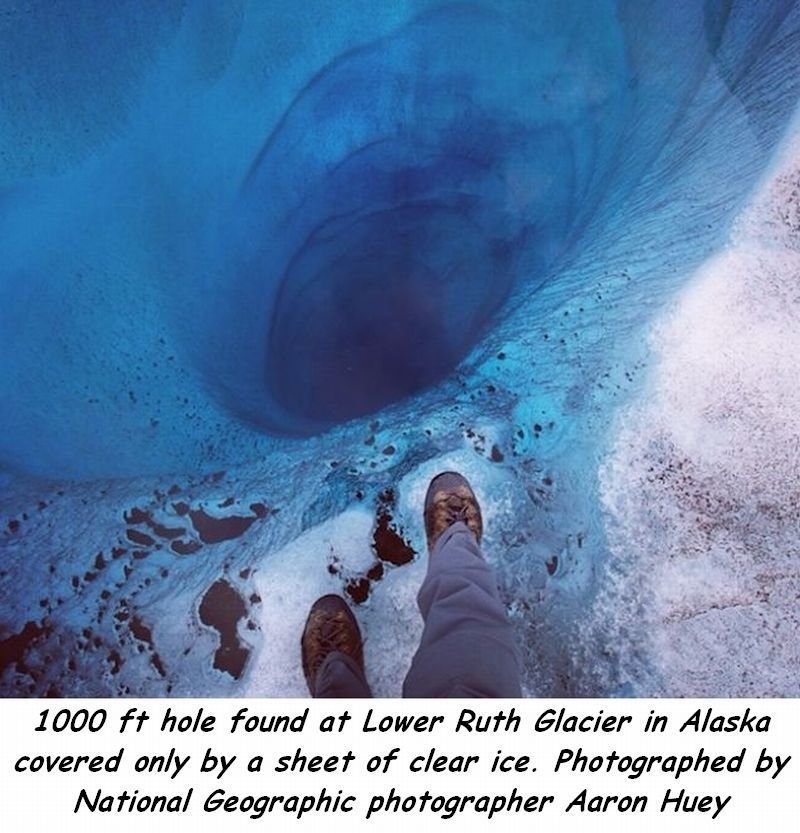 strange things that happened in the world - 1000 ft hole found at Lower Ruth Glacier in Alaska covered only by a sheet of clear ice. Photographed by National Geographic photographer Aaron Huey