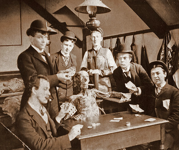 Card-playing medical students pose with a cadaver, c. 1890