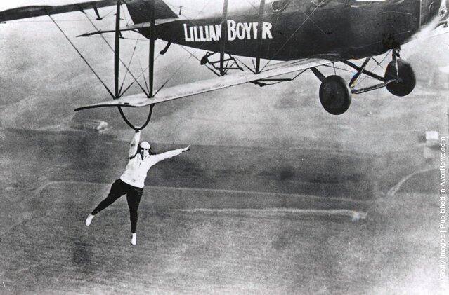 Lillian Boyer, stunt flying acrobat in action, 1922.