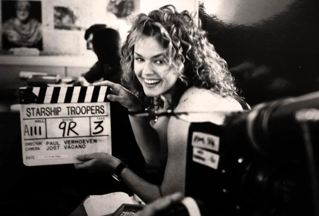 Dina Meyer messing around while filming Starship Troopers in 1997.
