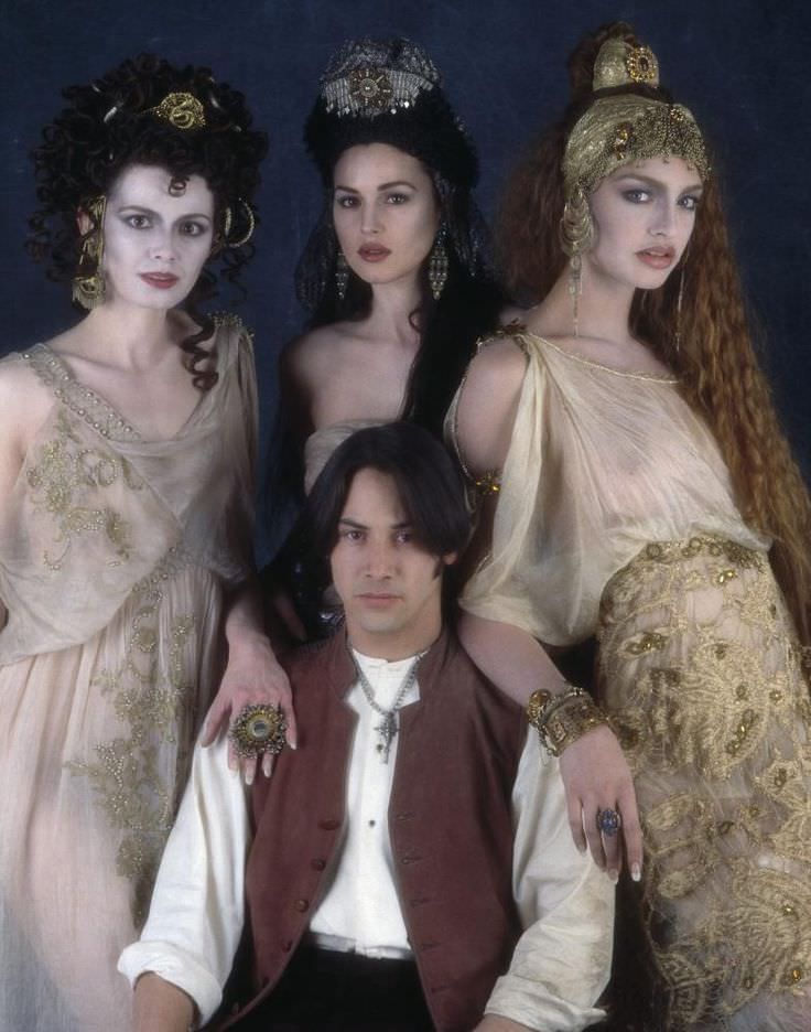 Florina Kendrick, Monica Bellucci, and Michaela Bercu do a promotional picture with Keanu Reeves for Bram Stoker's Dracula in 1992.