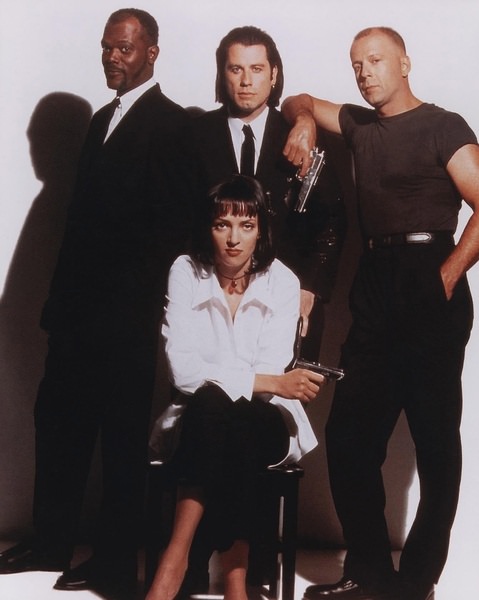 Samuel L Jackson, John Travolta, Bruce Willis and Uma Thurman doing a promo picture for Pulp Fiction in 1994.