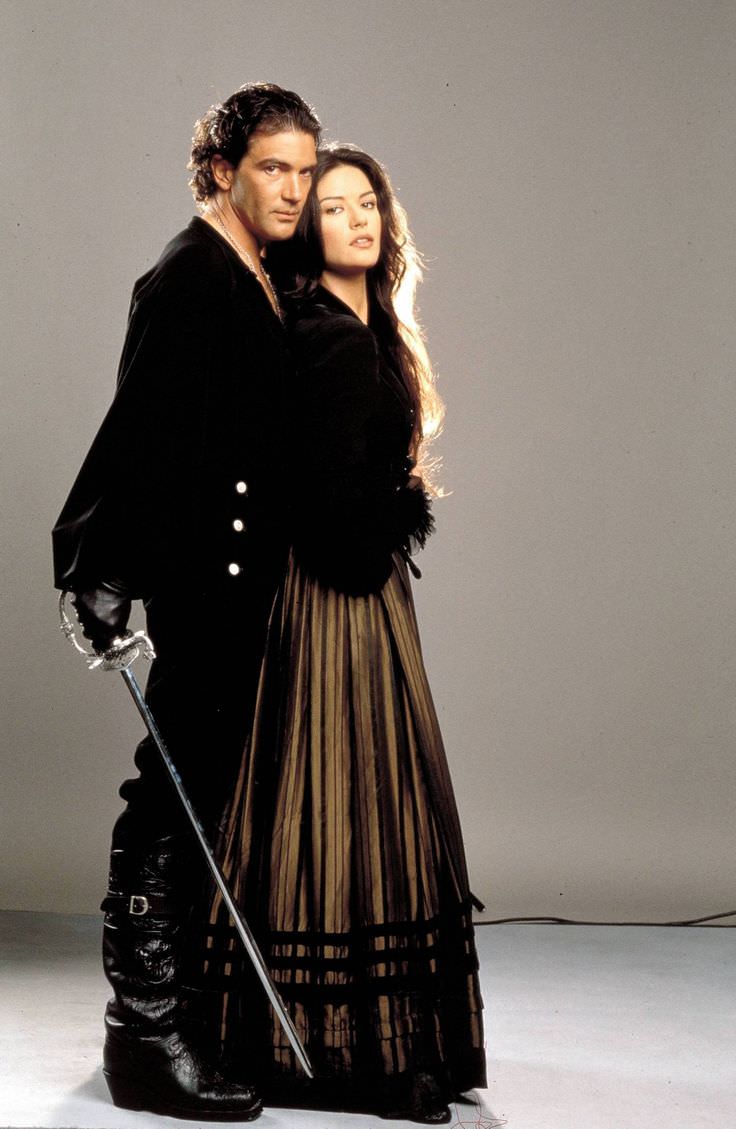 Antonio Banderas and Catherine Zeta Jones do a promo picture for The Mask of Zorro in 1998.