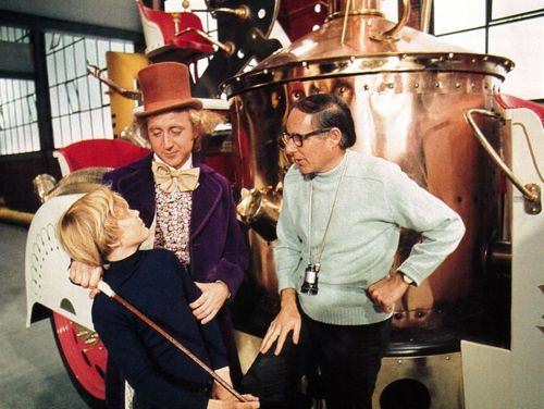 Director Mel Stuart having a moment with Gene Wilder and Peter Ostrum prior to filming a scene in Willy Wonka & the Chocolate Factory in 1971.