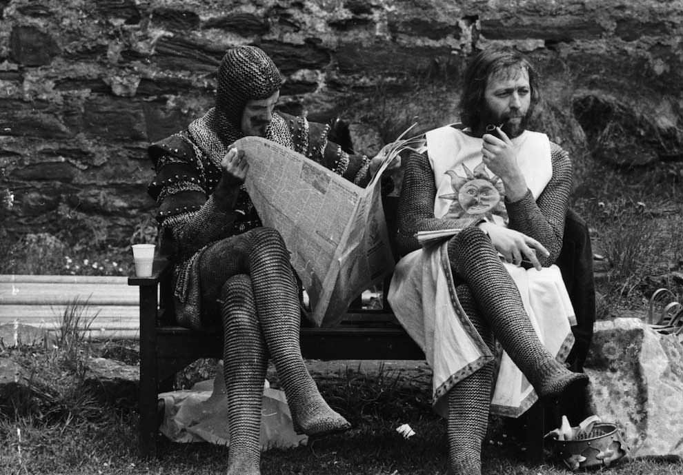 John Cleese and Graham Chapman take a break between filming scenes.