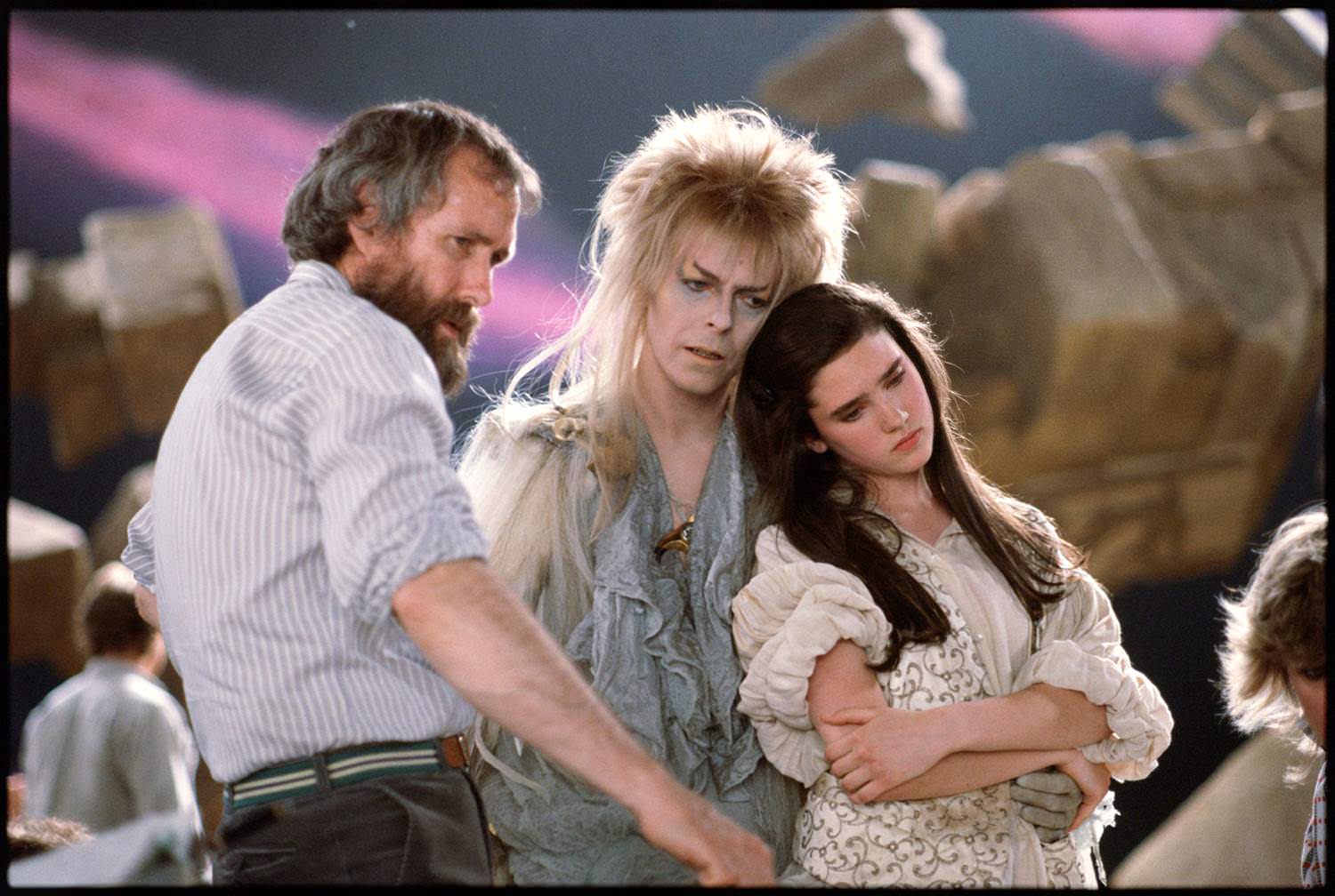 Director Jim Henson showing David Bowie and Jennifer Connelly how he wants them to look for a scene in Labyrinth in 1986.
