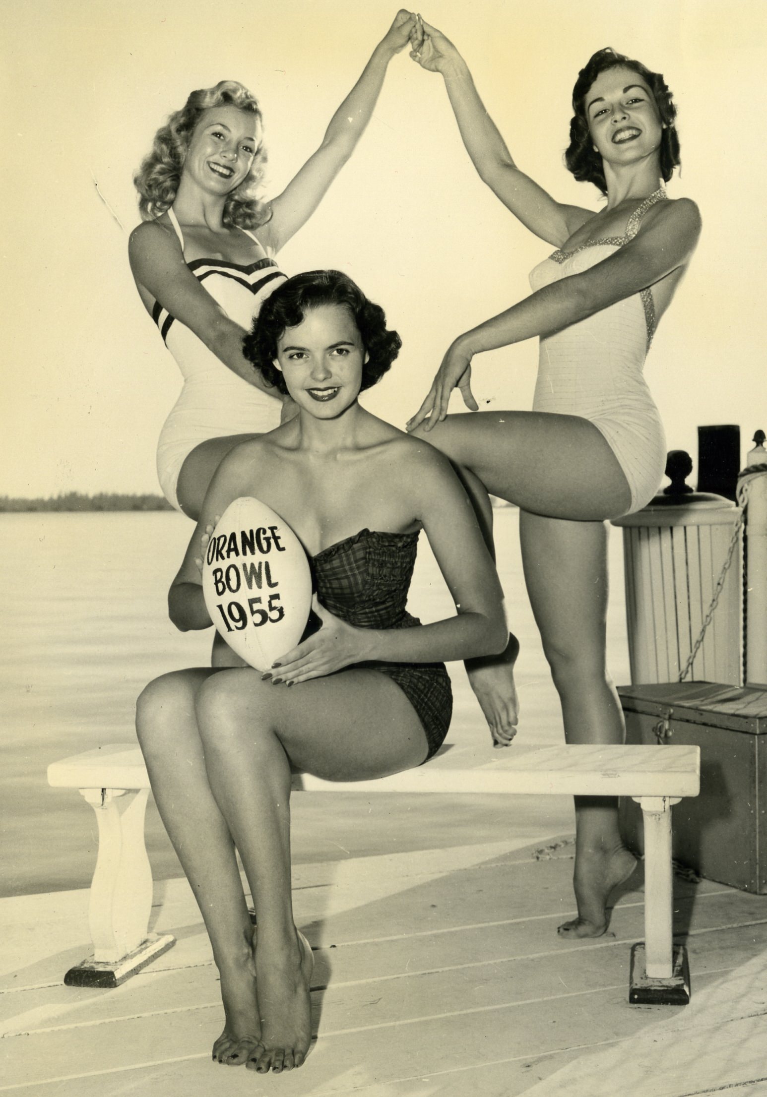 University of Floridas first homecoming queen (1953) Carolyn Stroupe (center) and the next 2 queens promote the Orange Bowl in Florida, US in 1955.