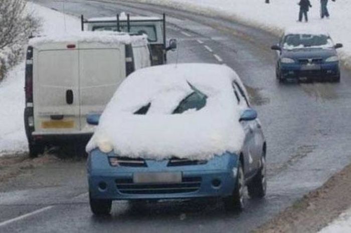 clearing snow off car