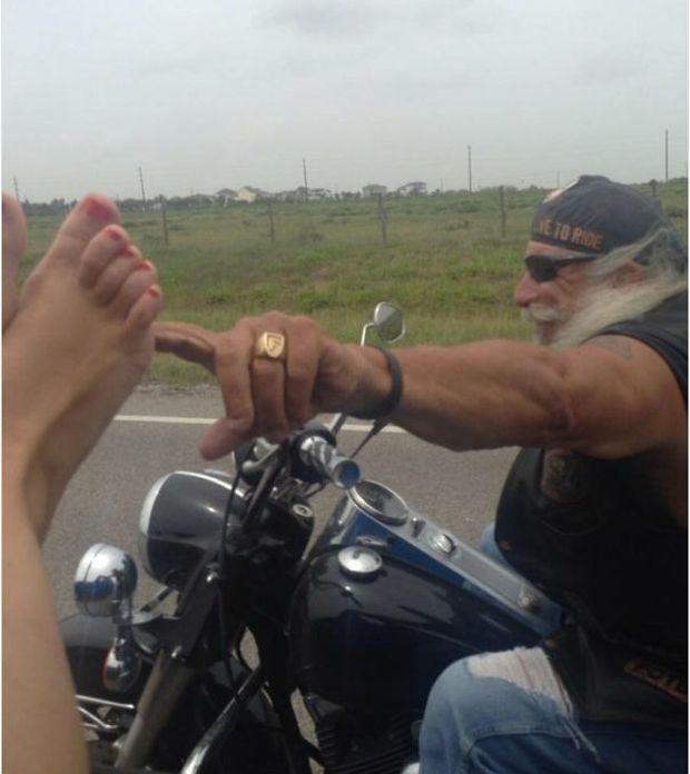 Keep your feet in the vehicle or... an old biker will tickle you?