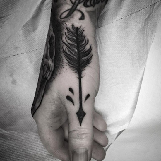 tattoo art arrow tattoo hand