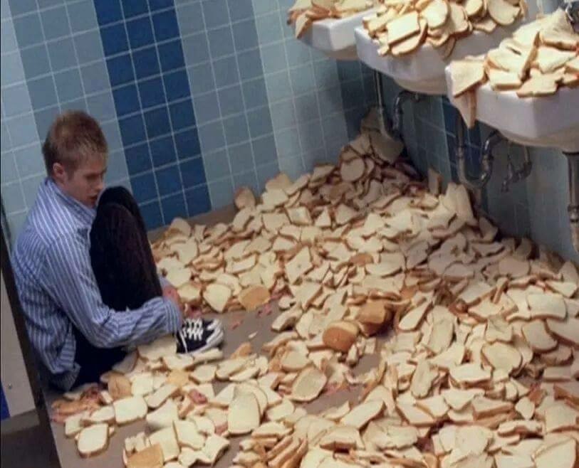 guy surrounded by bread