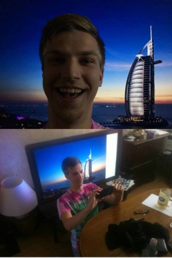 Guy by a skyscraper. Guy taking picture with skyscraper on computer.