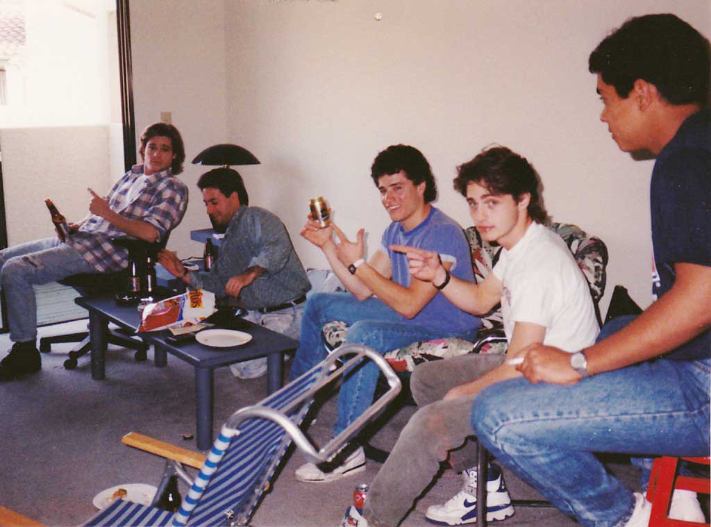 Brad Pitt (far left) and Jason Priestley (second from right) hanging out with friends in their shared apartments before being famous, in 1987.
