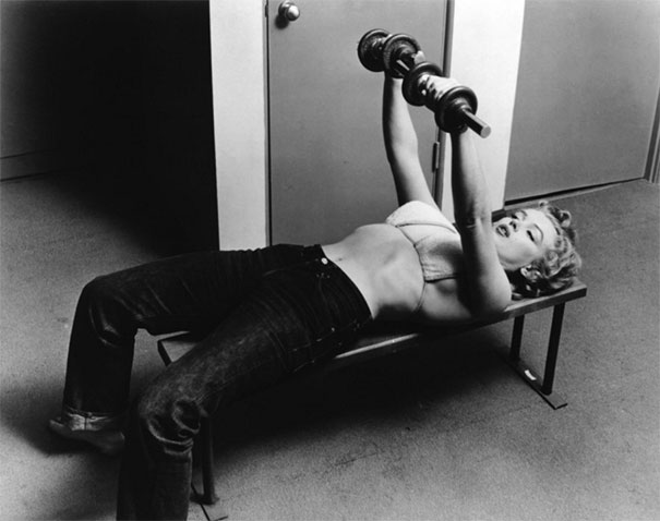 Marilyn Monroe lifting weights for a photo shoot in 1952.