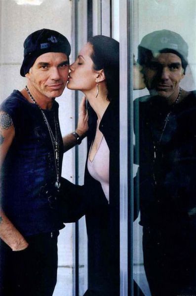 Billy Bob Thornton getting a kiss from his then wife Angelina Jolie, in 2001.