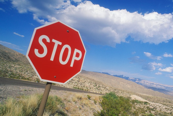 Fire rocks at stop signs.