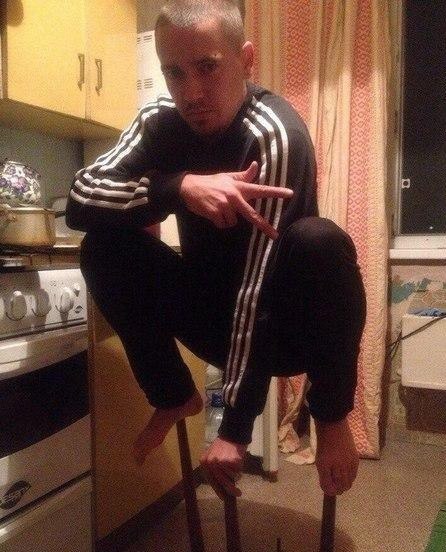 russia - europeans squatting in tracksuits