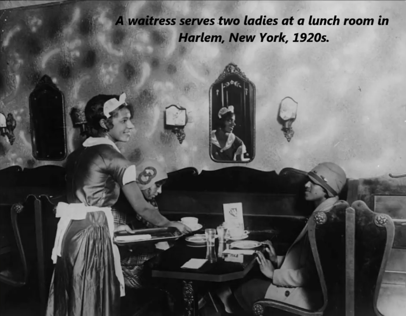 waiter 1920 - A waitress serves two ladies at a lunch room in Harlem, New York, 1920s.
