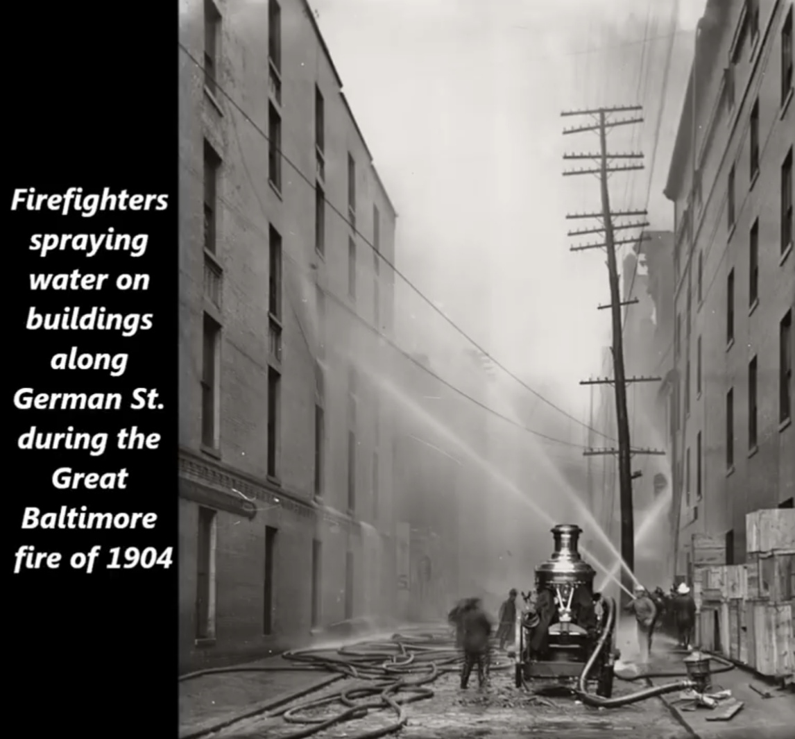 monochrome photography - Firefighters spraying water on buildings along German St. during the Great Baltimore fire of 1904