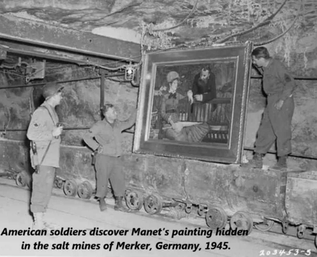 nazi art looting during world war ii - American soldiers discover Manet's painting hidden in the salt mines of Merker, Germany, 1945. 2034535