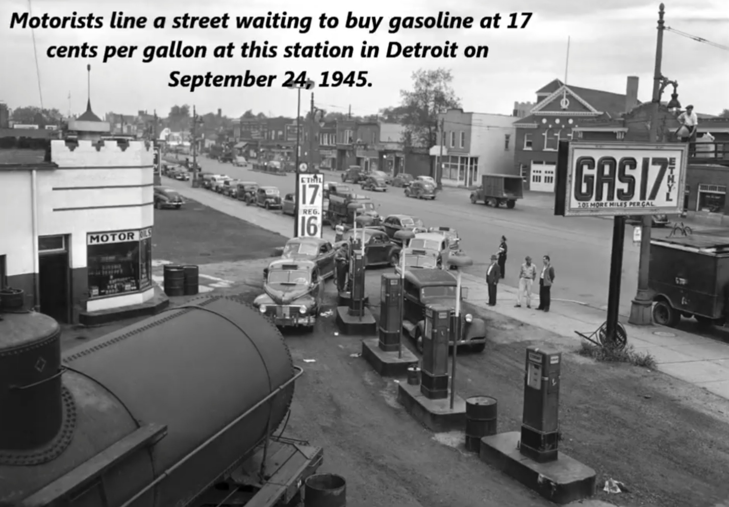 detroit in the 1940's - Motorists line a street waiting to buy gasoline at 17 cents per gallon at this station in Detroit on . E11 Sthl |_ GASI7. 201 More Niles Per Cal Reg Motor Oils